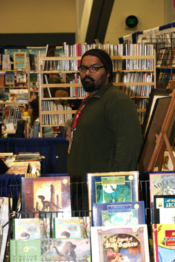 James Walker II helping at the Flesk Publications booth.