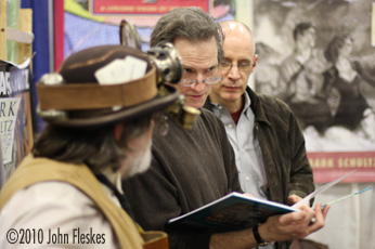 Gary Gianni providing a sketch inside his Twenty-Thousand Leagues Under the Sea adaptation while Mark Schultz looks on at the 2009 WonderCon.